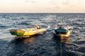 Two big fast empty dinghy being towed by a diving motor boat, Red Sea, Sudan Royalty Free Stock Photo