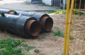 Two big metallic pipes on the ground. Communication replacement. Construction works