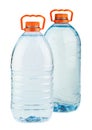 Two big plastic water bottles with orange caps Royalty Free Stock Photo