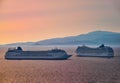 Two big tourist cruise liners manoeuvre in harbor. Beautiful sunset sky. Colorful shot at golden hour. Sea voyage Royalty Free Stock Photo