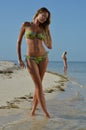 Two bikini models posing at tropical beach Royalty Free Stock Photo