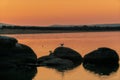 Two Birds silhouette in a rock at sunrise Royalty Free Stock Photo