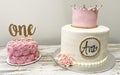 Two birthday cakes for one year olds party Royalty Free Stock Photo