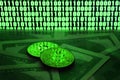 Two bitcoins lies on a pile of dollar bills on the background of a monitor depicting a binary code of bright green zeros and one u