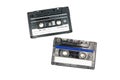 Two black cassettes on white background. Vintage audio tapes. Old-fashioned musical objects