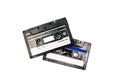 Two black cassettes on white background. Vintage audio tapes. Old-fashioned musical objects