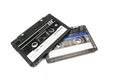 Two black cassettes on white background. Vintage audio tapes. Old-fashioned musical objects