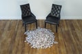 Two Black Chairs In Minimalist Interior With Stack Of Money Royalty Free Stock Photo