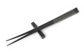 Two black chopsticks isolated Royalty Free Stock Photo