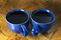 Two Black Coffees in Blue Mugs Royalty Free Stock Photo