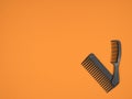 Two black combs on an orange background Royalty Free Stock Photo