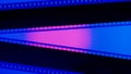 Two black film strips on blue background close up. 35mm film slide frame. Copy space.