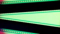 Two black film strips on green background close up. 35mm film slide frame. Copy space.