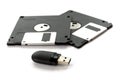 Two black floppy disks and a flash drive Royalty Free Stock Photo