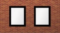 Two black frames on a brick wall. Vector mock up