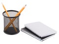 Two notepad and next to container with sharp pencils inside. Isolated on white background. Royalty Free Stock Photo