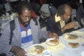 Two black men eating Christmas Royalty Free Stock Photo