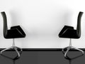 Two black office armchairs indoor