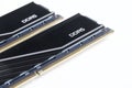 Two black RAM DDR5 DIMM modules with a heat sink on a white background. Modern technologies. Photo. Selective focus. Copy space