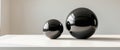 Two black round objects on a white table. Royalty Free Stock Photo