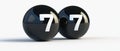 TWO BLACK SPHERES WITH THE NUMBER 7 Royalty Free Stock Photo