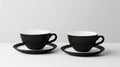 Two Black Teacups and Saucers on White Table Royalty Free Stock Photo