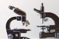 Two black vintage microscopes, side view Royalty Free Stock Photo