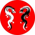 Two black and white dragons on red circle