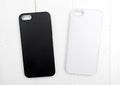Two black and white iphone cases, topview Royalty Free Stock Photo