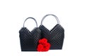 Two black wicker woman`s tote bag with flowers Royalty Free Stock Photo