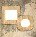 Two blank cardboard frames on grunge wall Royalty Free Stock Photo