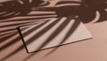 Two blank cards casting shadows from tropical leaves on a textured surface Royalty Free Stock Photo