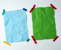 Two blank crumpled sheets of paper glued with rubber colored adhesive tape