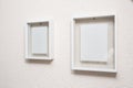 Two blank frame on white wall clean modern design Royalty Free Stock Photo