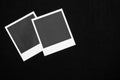Two blank instant photo frames on black background with copy space top view Royalty Free Stock Photo