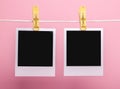 Two blank photo cards isolated on pink background