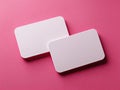 Two blank, rectangular cards with rounded corners lie on a vibrant pink background Royalty Free Stock Photo