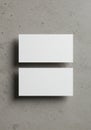 Two blank, rectangular white cards are positioned vertically on a textured concrete Royalty Free Stock Photo