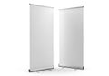 Two blank retractable banner stands with silver bases on a white background for your graphic design Royalty Free Stock Photo
