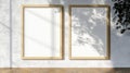 Two Blank Vertical Wooden Picture Frames Mockup on Empty Wall with Sunlight Shadow, 3D Rendering Royalty Free Stock Photo