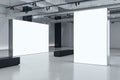 Two blank white bright partitions with space for advertising poster or marketing campaign in industrial gallery hall with black Royalty Free Stock Photo