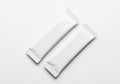 Two blank white foil wrappers for snacks or candy on a white background Royalty Free Stock Photo