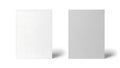Two blank white and gray rectangles standing upright on plain surface Royalty Free Stock Photo