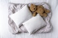 Two Blank White Pillows On a Patterned Grey Background With Teddy Bear Mockup - Styled Stock Photography