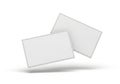 Two blank white rectangular cards floating in a clean studio environment with subtle shadows Royalty Free Stock Photo