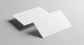 Two blank white rectangular cards floating on a light gray surface Royalty Free Stock Photo