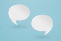 blank white speech bubble paper cut ,  on blue paper background. Conceptual image about communication and social media Royalty Free Stock Photo