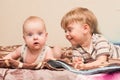 Two brothers lie on the bed Royalty Free Stock Photo