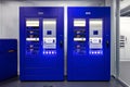 Two blue automated storage units in lab