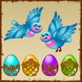 Two blue birds with colored eggs in a golden stand